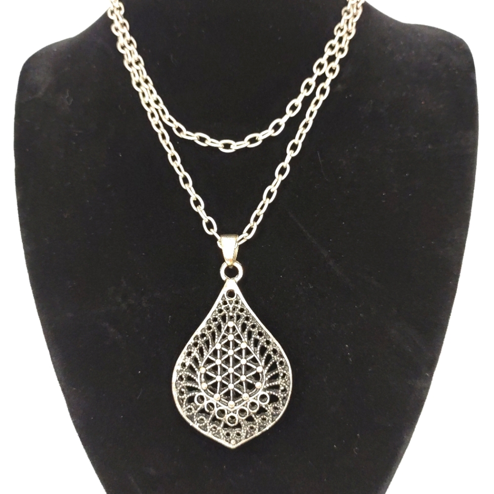 Long intricate pendant necklace